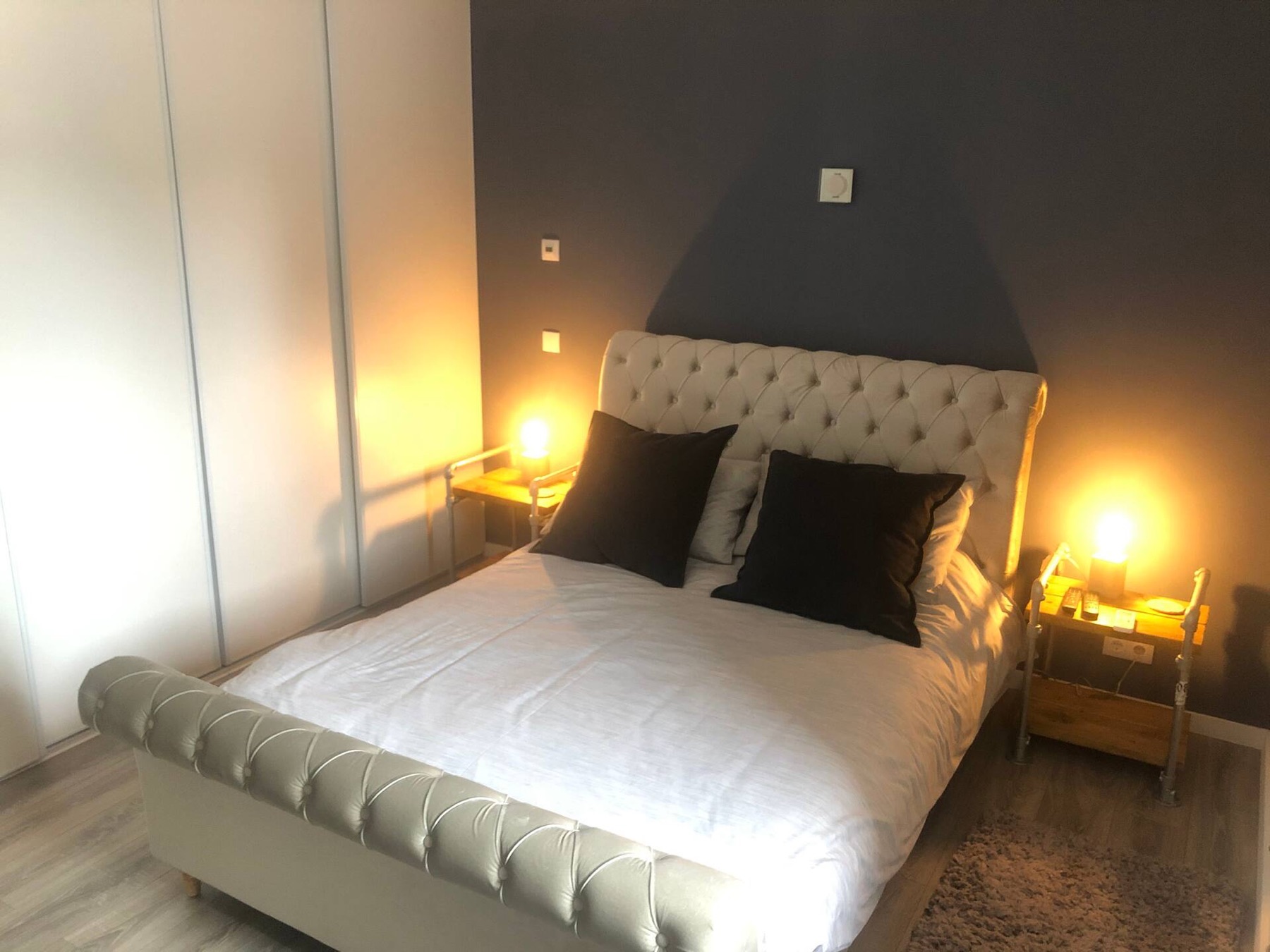 Villa Verde bedroom suite with warm evening lighting