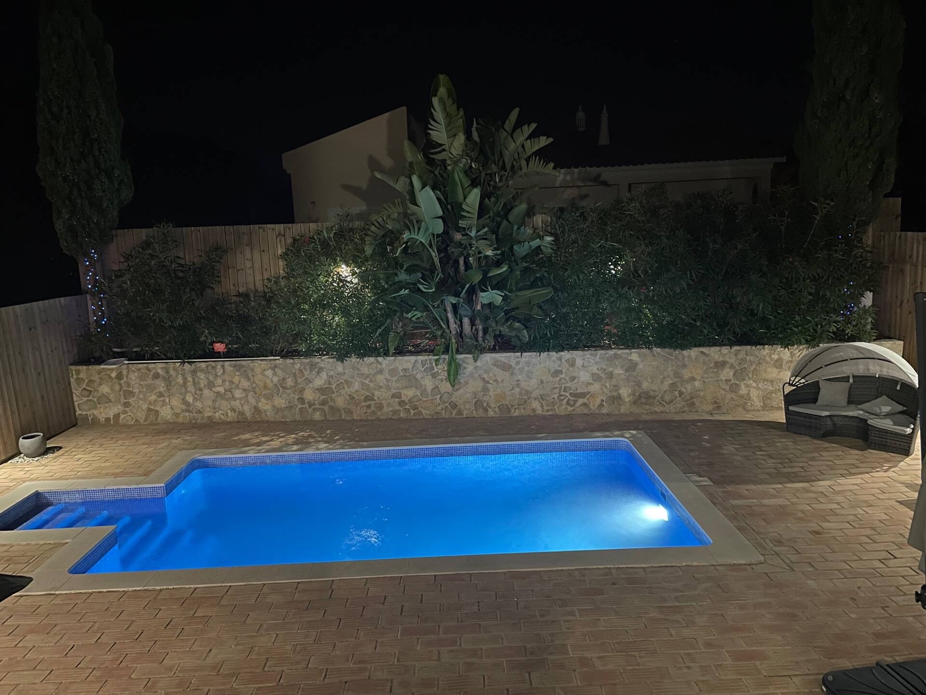 Villa Verde pool and spa corner lit up at night